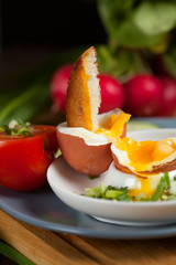 Healthy breakfast - soft boiled egg with toast and herb - healthy breakfast. Selective focus