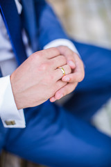 Engagement ring on the groom's finger