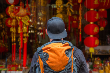 Man with backpack and chinese red lanterns