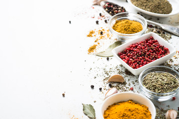 Spices in a bowls on white.