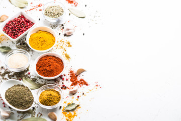 Spices in a bowls on white.