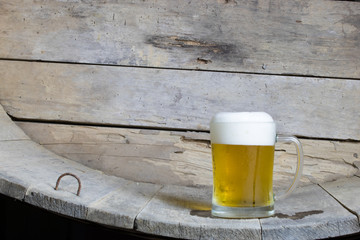 cold beer on the table wood background