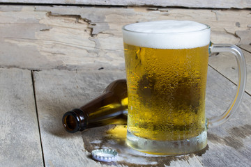 cold beer on the table wood background