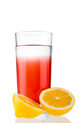 Fresh juice and sliced lemon on white background