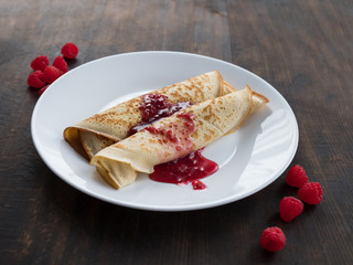 pancakes on a plate with jam