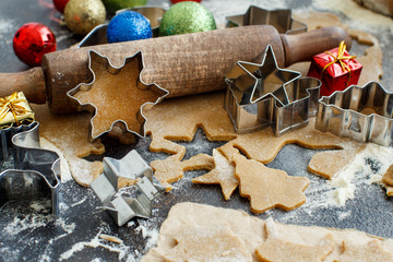 Cooking cookies with  cookie cutters and christmas decorations
