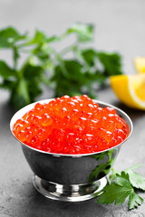 Red salmon fish caviar, salmon caviar in metal bowl. Caviar. Selective focus