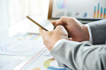 Businessman using cell phone.