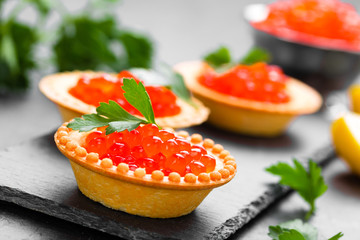 Tartalets with red salmon fish caviar, salmon caviar. Caviar. Selective focus