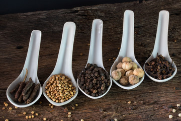 seasoning herbal in spoon on wood table for ingredient of food