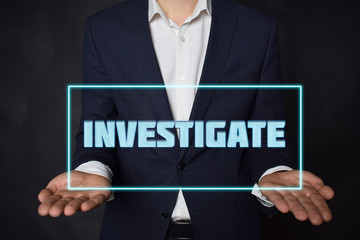 A businessman shows an inscription:INVESTIGATE