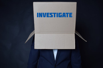 The businessman is holding a box with the inscription:INVESTIGATE