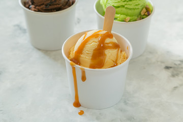 Caramel ice cream in paper cone