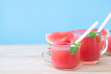watermelon slice drink juice on wood table.