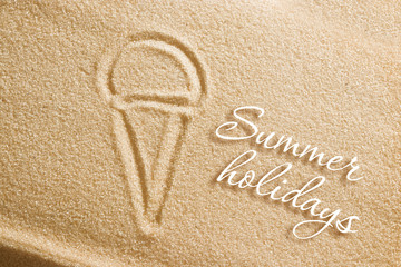 The ice cream is painted on the sand and the inscription is summer holidays. Beach background. View from above. The concept of summer, summer kanikkuly, vacation, holydays.