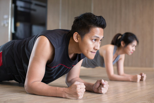 Couple Doing Plank