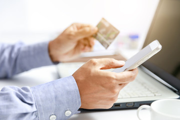 businessman do online shopping with credit card and mobile phone