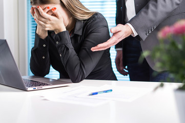 Upset woman crying in office. Getting fired from job. Business man or boss apologizing, comforting...