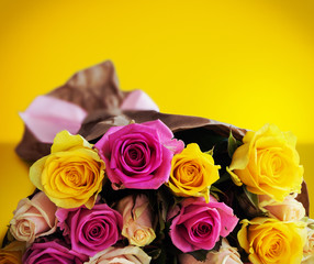 Bouquet of roses on yellow background