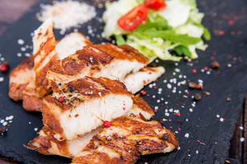 Grilled turkey fillet and vegetables in restaurant