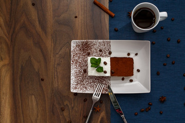 dessert tiramisu on wooden table with cup of coffee
