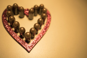 Red bullet shotgun cartridges in tin heart shape tin box. Gift for real man.