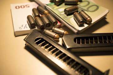 ammo and money on the table, the concept of chaos and banditry