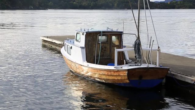 small boat connected to the port