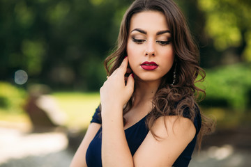 Naklejka premium Portrait of beautiful girl with prifessional makeup and hair style