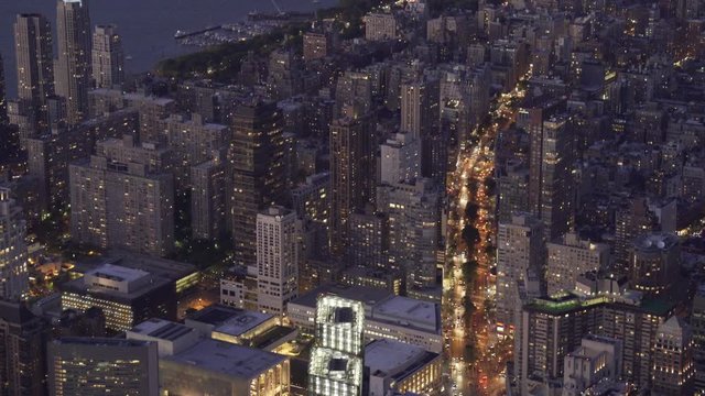 New York City aerial view over the Upper West Side at night, featuring traffic on Broadway.