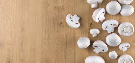 3D Rendering Of Realistic Mushroom Pieces Top View On Wooden Surface