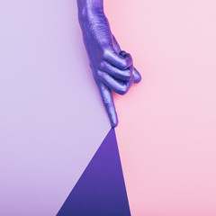 painted pearly purple hand is touching the color. ultra violet concept. pastel minimal. beauty and...
