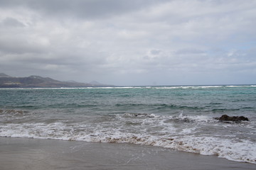 beach in the ocean on a windy cloudy day