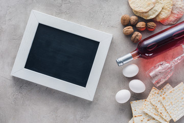 top view of frame, wine and matza, jewish Passover holiday concept