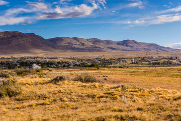 Landscape view in Laguna Nimez during golden hour. Exotic colors,  mountain range in the background.