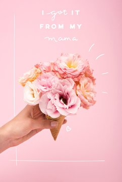 mothers day greting card with person holding waffle cone with beautiful blooming flowers isolated on pink