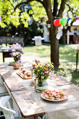 Table set for a garden party or celebration outside.