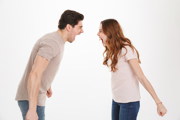 Portrait of an angry young couple yelling