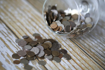 Accumulated coins stacked in glass jars