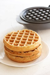 Homemade Mini Waffles stacked up, selective focus