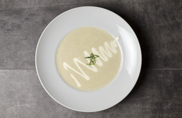 Cream of mushroom soup on a white plate
