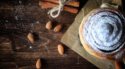 Pie with cinnamon and apples on a wooden table. Fresh pastry wit
