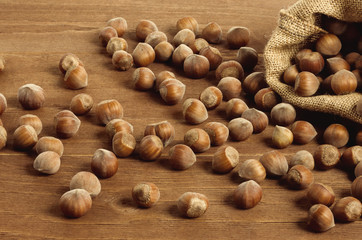 Hazelnuts in a yuta bag on wooden table