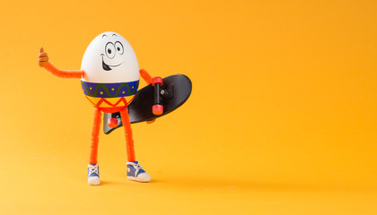 Easter egg standing with miniature skateboard