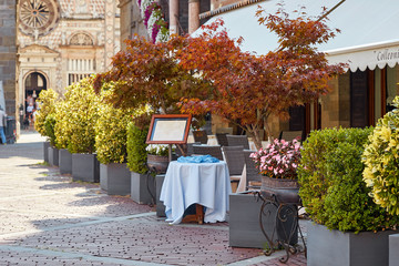 Bergamo, Italy - August 18, 2017: Cozy street cafe in the upper city.