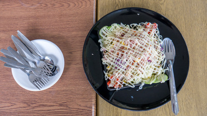 Tuna salad with fork and spoon.
