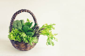 Assorted green vegetables in a basket