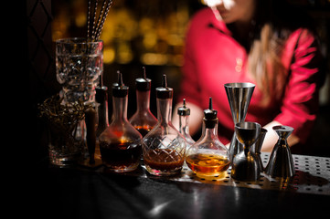 Barman essentials on the blurred background of female barthender