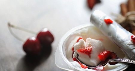 Fresh yogurt with berries. Ice cream in a bowl with fresh and ju