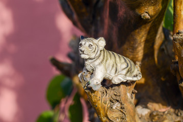 tiger sculpture on tree